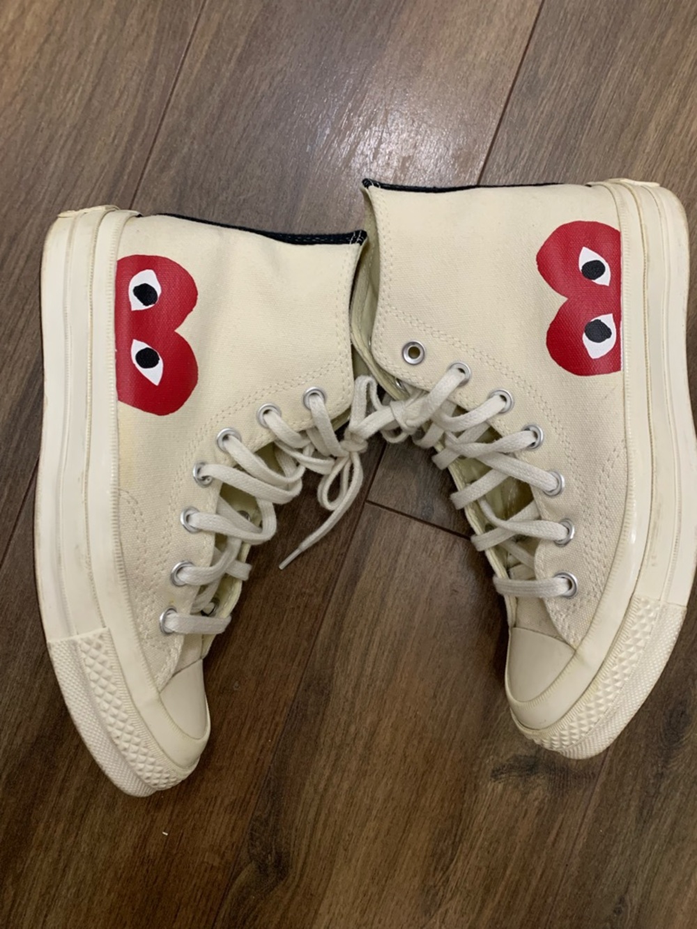 Comme Des Garcons Play X Converse High Top Sneakers in Cream women’s 6